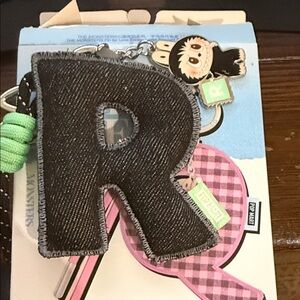 Charming Black 'R' Keychain with Green Details